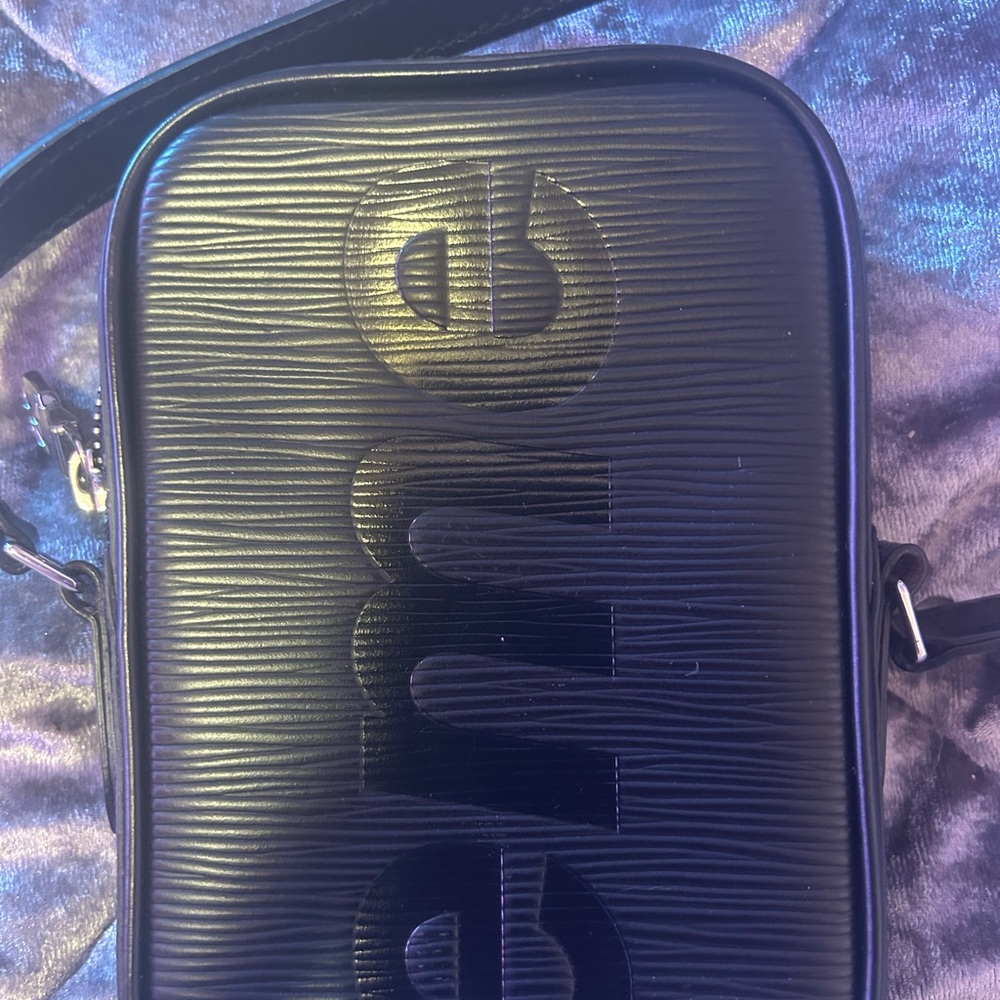 Louis Vuitton Black Ribbed Crossbody Bag with Embossed Design